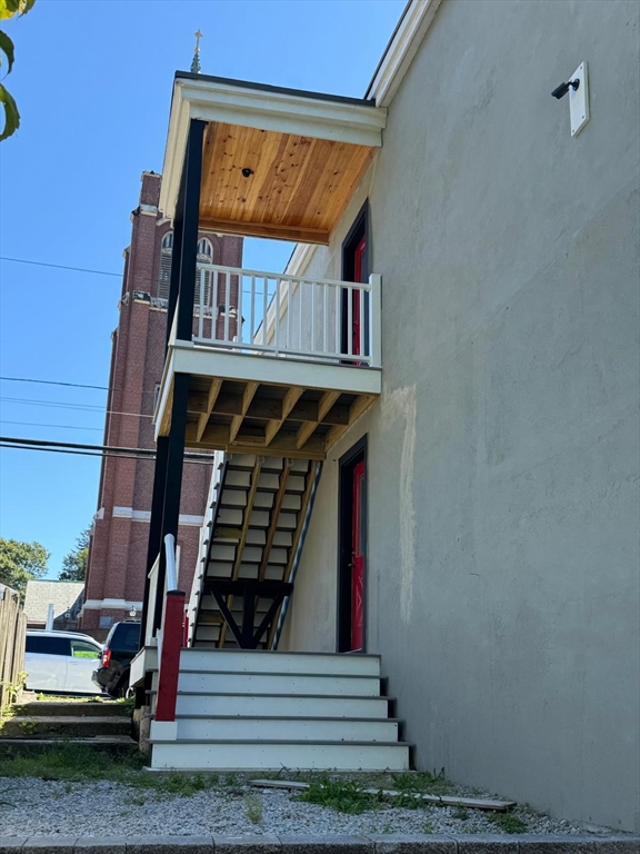 56 Whitcomb Street Webster, MA 01570 - Photo 7 of 18 a front view of a house with entryway