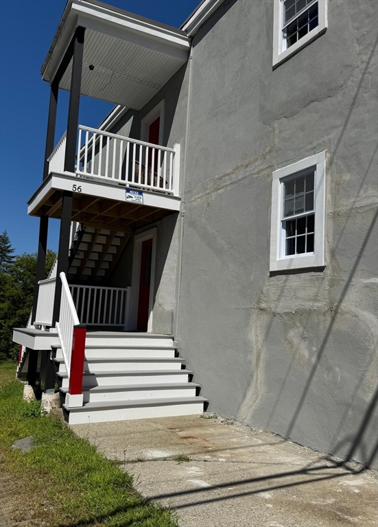 56 Whitcomb Street Webster, MA 01570 - Photo 9 of 18 a view of a house with a deck