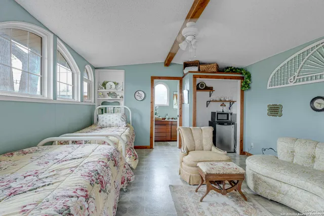 a bedroom with a bed and a couch