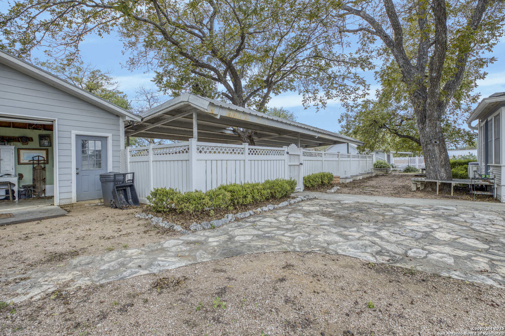 1201 10th Street Hondo, TX 78861 - Photo 45 of 46 a view of a house with a yard and large tree