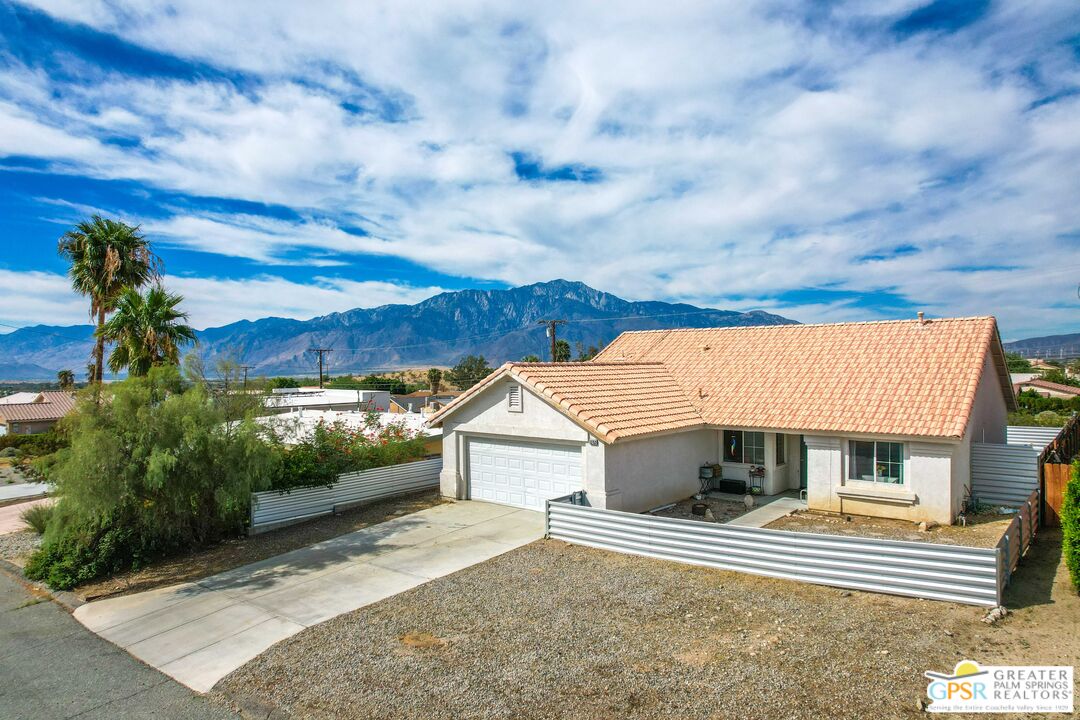 13753 Inaja Street Desert Hot Springs, CA 92240 - Photo 1 of 24 a view of a house with a yard