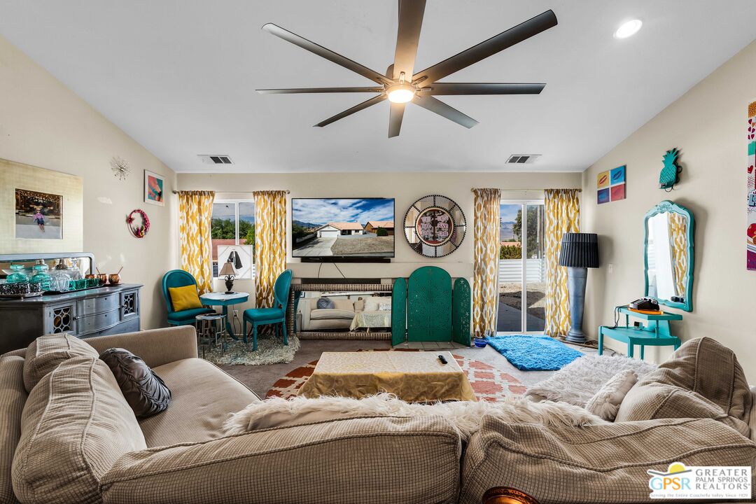 13753 Inaja Street Desert Hot Springs, CA 92240 - Photo 11 of 24 a living room with furniture and a wooden floor