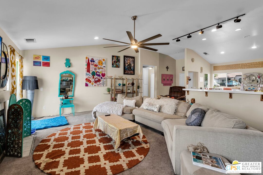 13753 Inaja Street Desert Hot Springs, CA 92240 - Photo 14 of 24 a living room with furniture and kitchen view