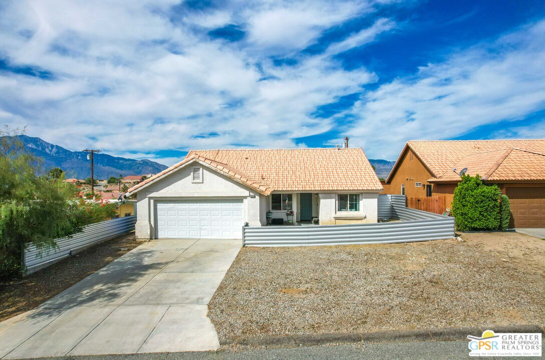 13753 Inaja Street Desert Hot Springs, CA 92240 - Photo 16 of 24 front view of house with a yard