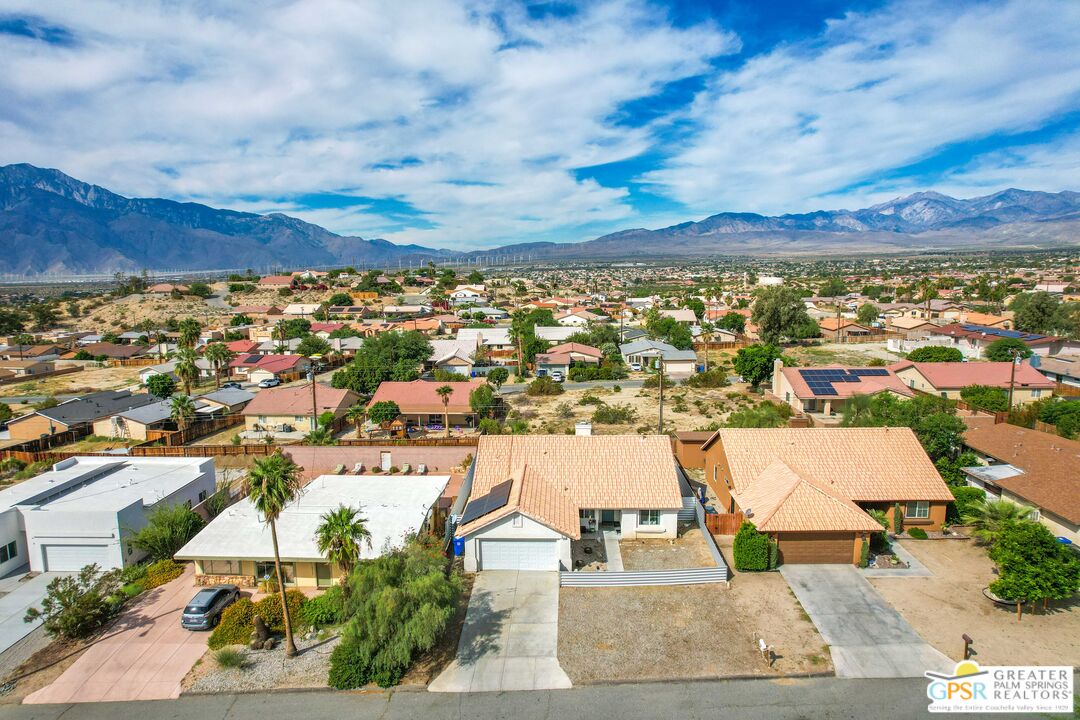 13753 Inaja Street Desert Hot Springs, CA 92240 - Photo 17 of 24 an aerial view of residential building and car parked