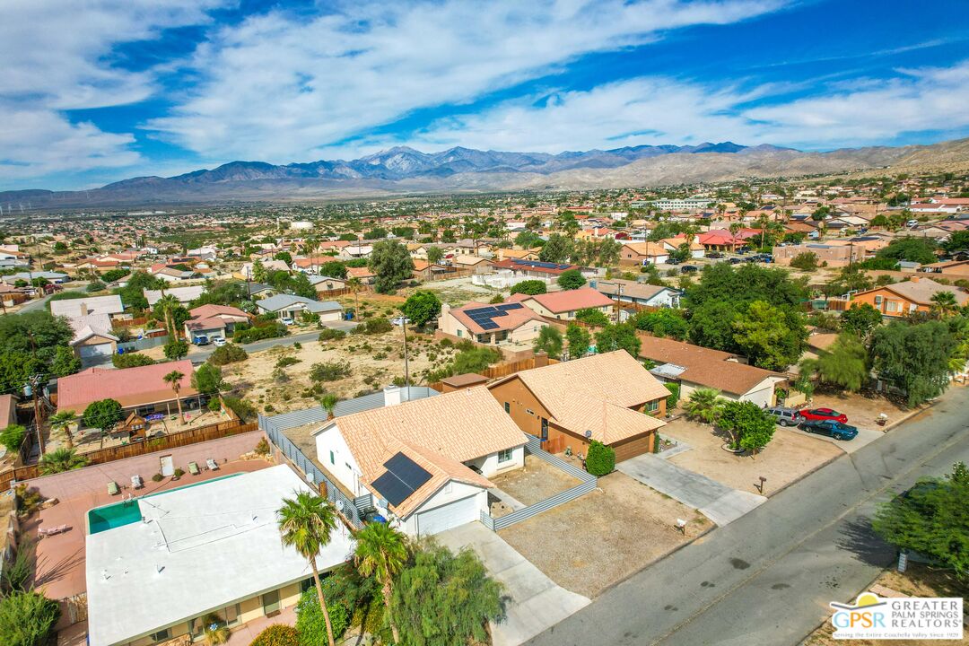 13753 Inaja Street Desert Hot Springs, CA 92240 - Photo 18 of 24 an aerial view of residential houses with outdoor space