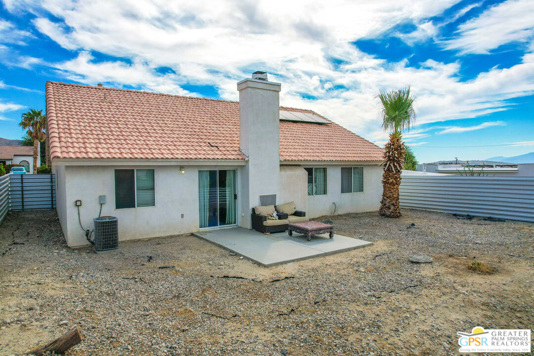 13753 Inaja Street Desert Hot Springs, CA 92240 - Photo 20 of 24 a front view of a house with patio
