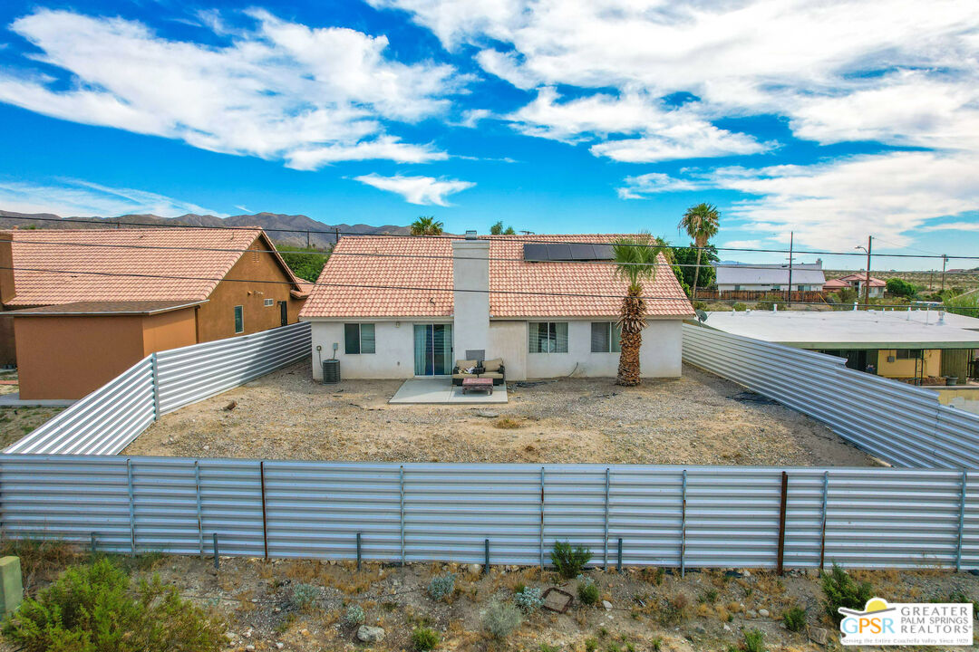 13753 Inaja Street Desert Hot Springs, CA 92240 - Photo 21 of 24 a view of a house with a balcony