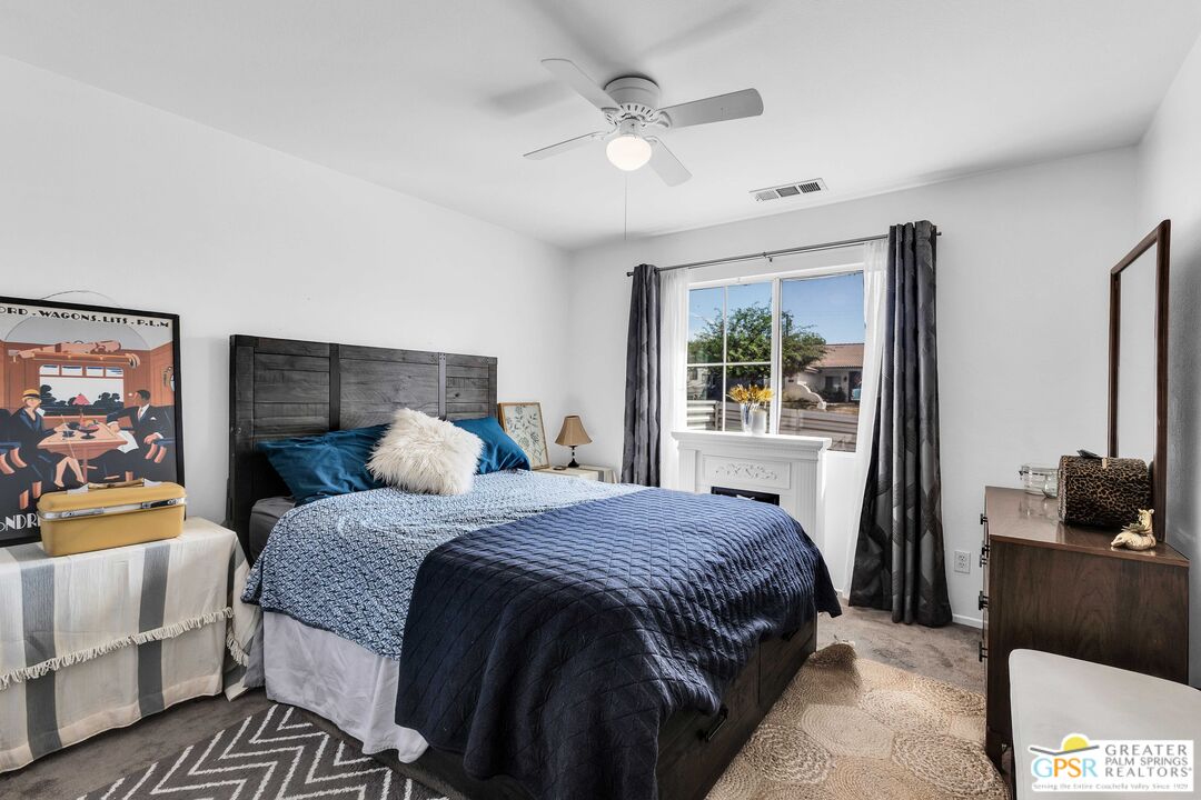 13753 Inaja Street Desert Hot Springs, CA 92240 - Photo 6 of 24 a bedroom with a bed and a window