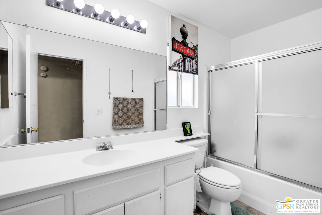 13753 Inaja Street Desert Hot Springs, CA 92240 - Photo 7 of 24 a bathroom with a sink toilet and shower