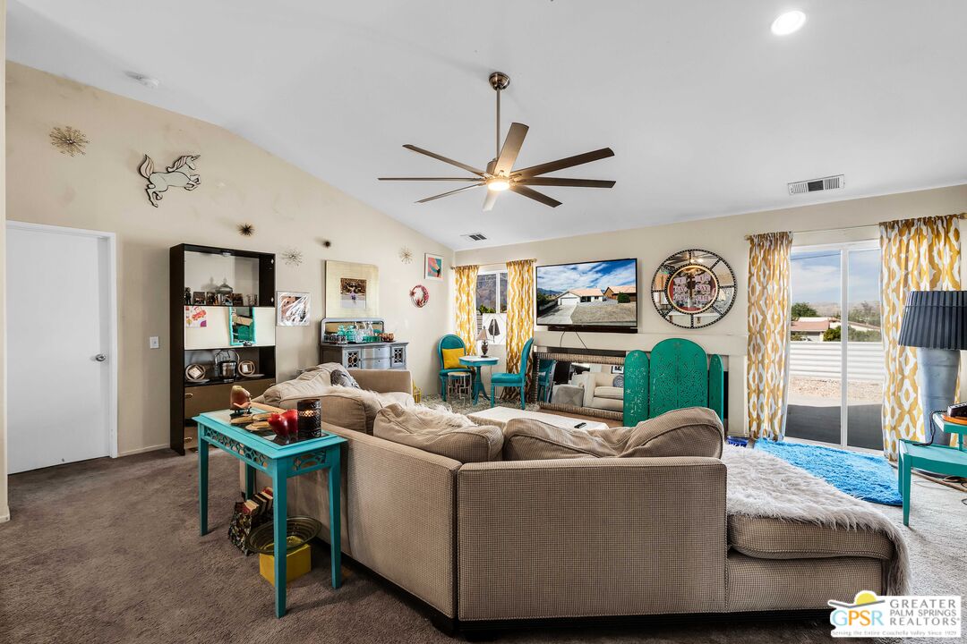 13753 Inaja Street Desert Hot Springs, CA 92240 - Photo 10 of 24 a living room with furniture and a large window
