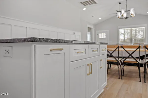 a view of a livingroom with furniture and chandelier