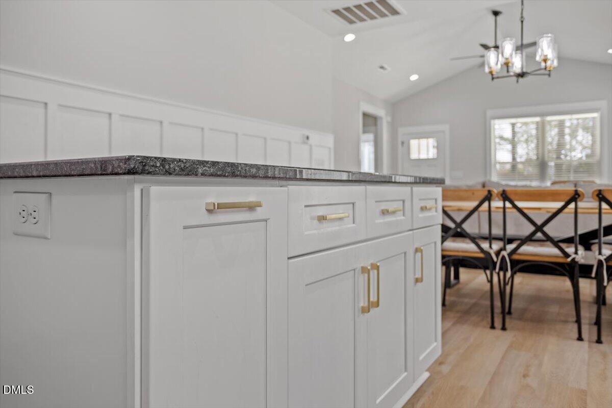 506 Dogwood Road Holly Springs, NC 27540 - Photo 19 of 42 a view of a livingroom with furniture and chandelier