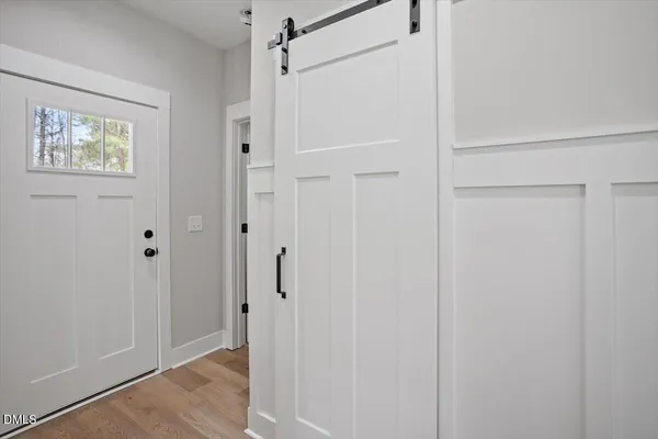a view of a bathroom with wooden floor