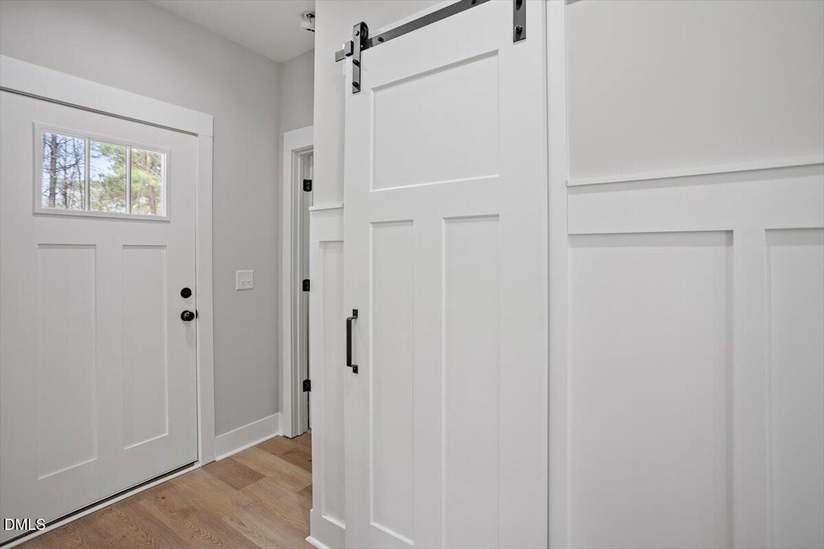 506 Dogwood Road Holly Springs, NC 27540 - Photo 20 of 42 a view of a bathroom with wooden floor