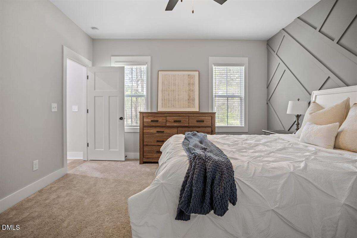 506 Dogwood Road Holly Springs, NC 27540 - Photo 23 of 42 a spacious bedroom with a bed and window