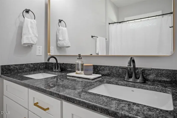 a bathroom with sink and mirror