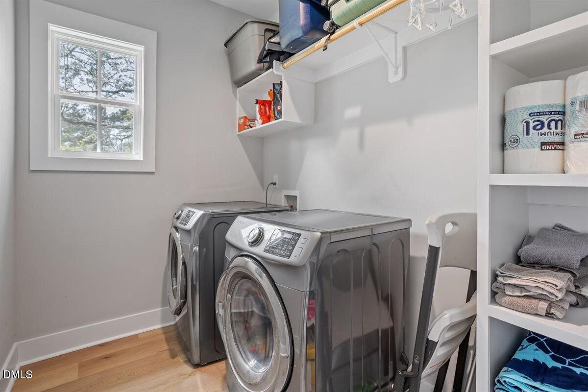 506 Dogwood Road Holly Springs, NC 27540 - Photo 34 of 42 a utility room with dryer and washer