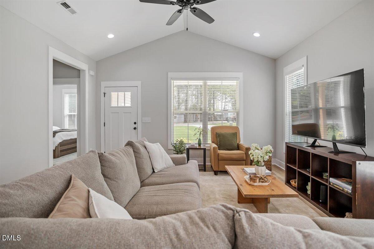 506 Dogwood Road Holly Springs, NC 27540 - Photo 6 of 42 a living room with furniture or window and a ceiling fan
