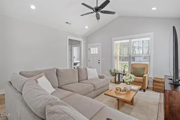 a living room with furniture and a large window