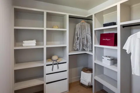 a bedroom with bed and a couch