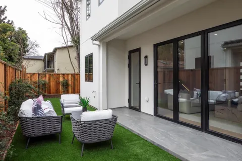 a backyard of a house with seating space