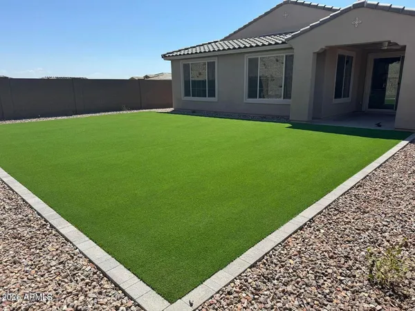 a view of a backyard with a garden
