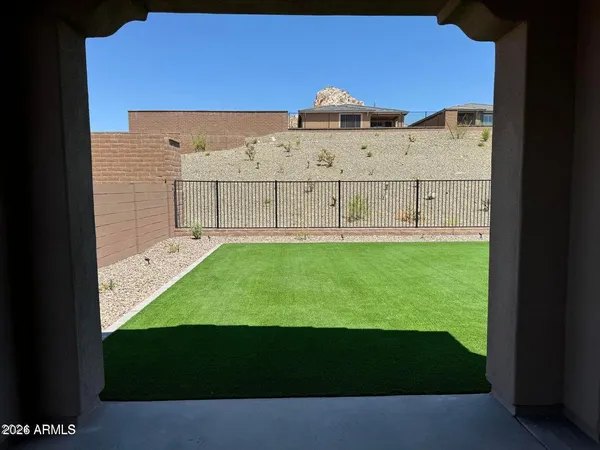 a view of an outdoor space with a building in the background