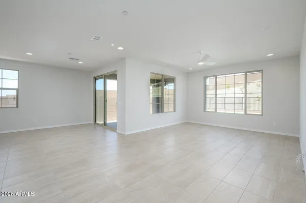 a view of an empty room with windows