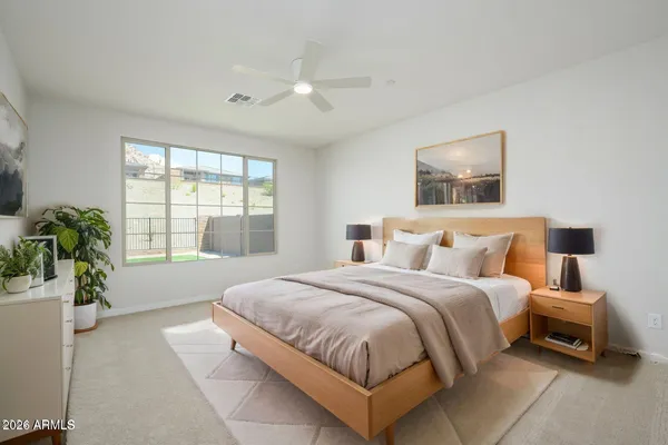 a bedroom with bed and window