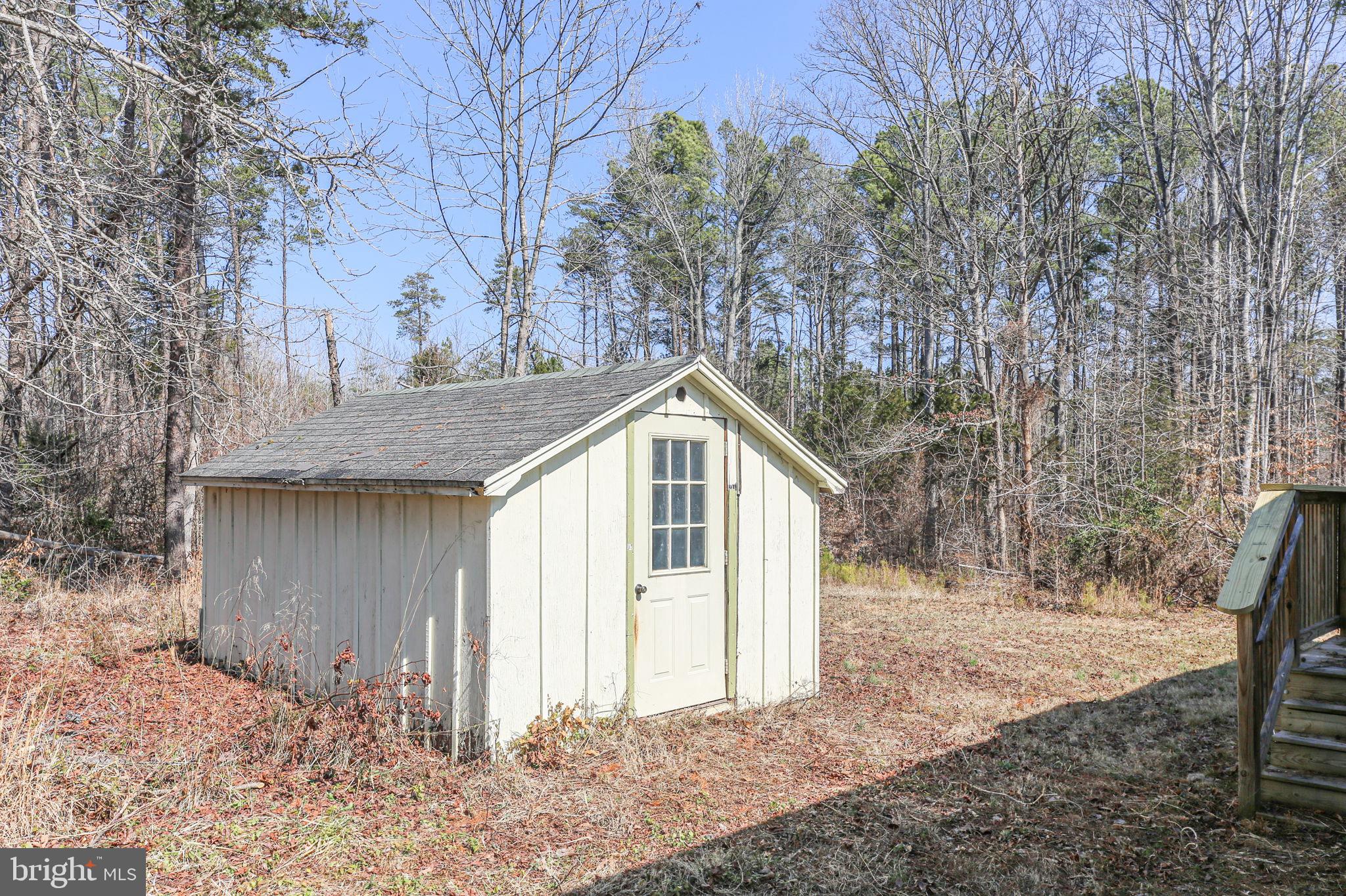 10000 Hummingbird Lane Partlow, VA 22534 - Photo 32 of 35 Charming shed nestled in serene woods.