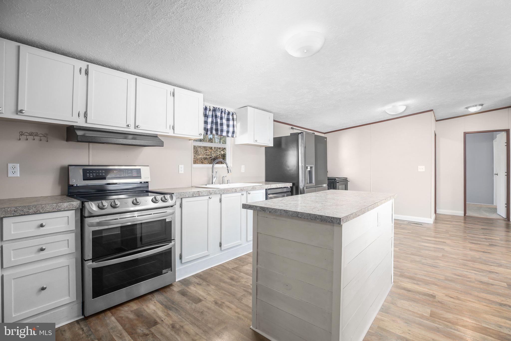 10000 Hummingbird Lane Partlow, VA 22534 - Photo 4 of 35 Modern kitchen with sleek finishes.