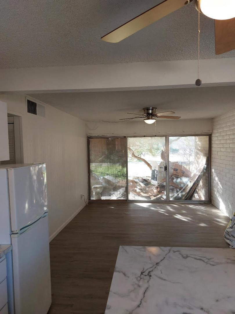 4140 East Cliffside Trail, Unit G Rimrock, AZ 86335 - Photo 11 of 25 a view of empty room with wooden floor and fan