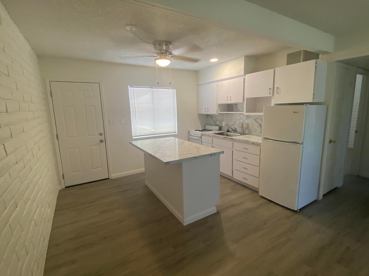 4140 East Cliffside Trail, Unit G Rimrock, AZ 86335 - Photo 13 of 25 a kitchen with stainless steel appliances granite countertop a refrigerator a sink and a stove