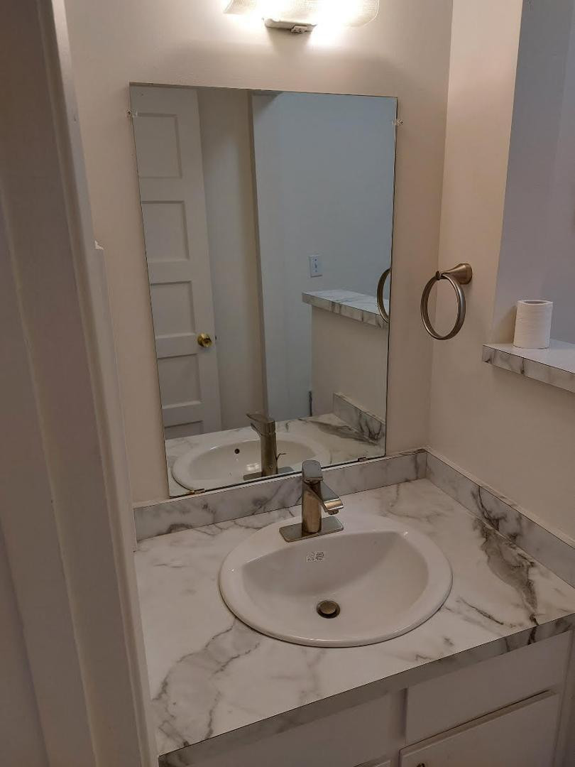 4140 East Cliffside Trail, Unit G Rimrock, AZ 86335 - Photo 19 of 25 a bathroom with a sink and a mirror