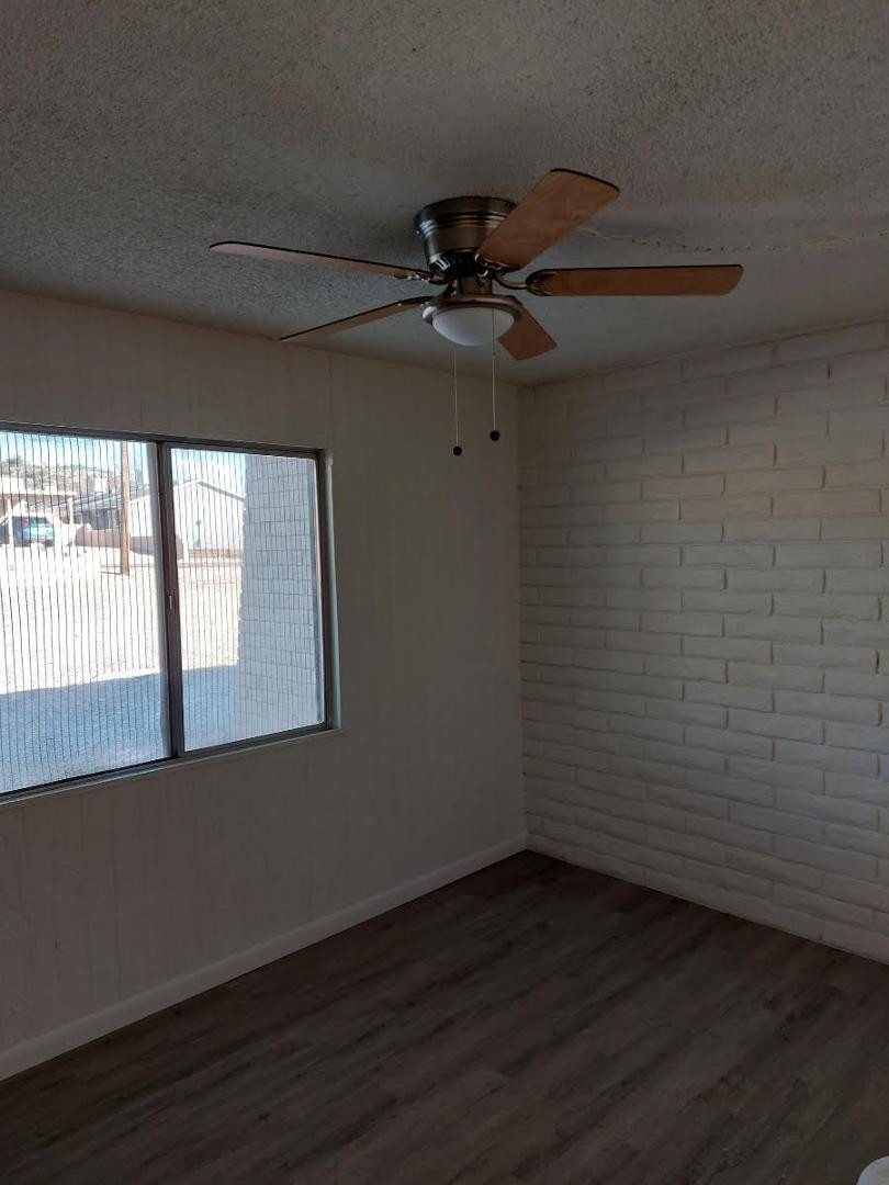 4140 East Cliffside Trail, Unit G Rimrock, AZ 86335 - Photo 20 of 25 a view of an empty room with a window