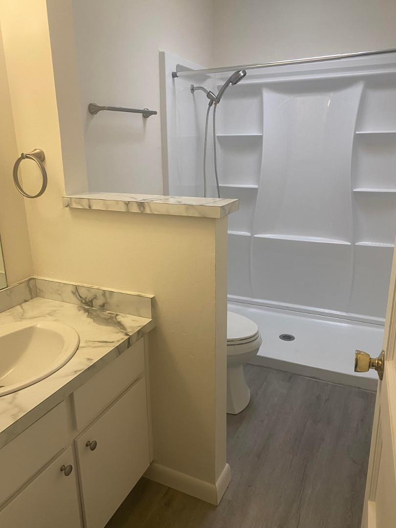 4140 East Cliffside Trail, Unit G Rimrock, AZ 86335 - Photo 2 of 25 a bathroom with a granite countertop sink a toilet and a mirror