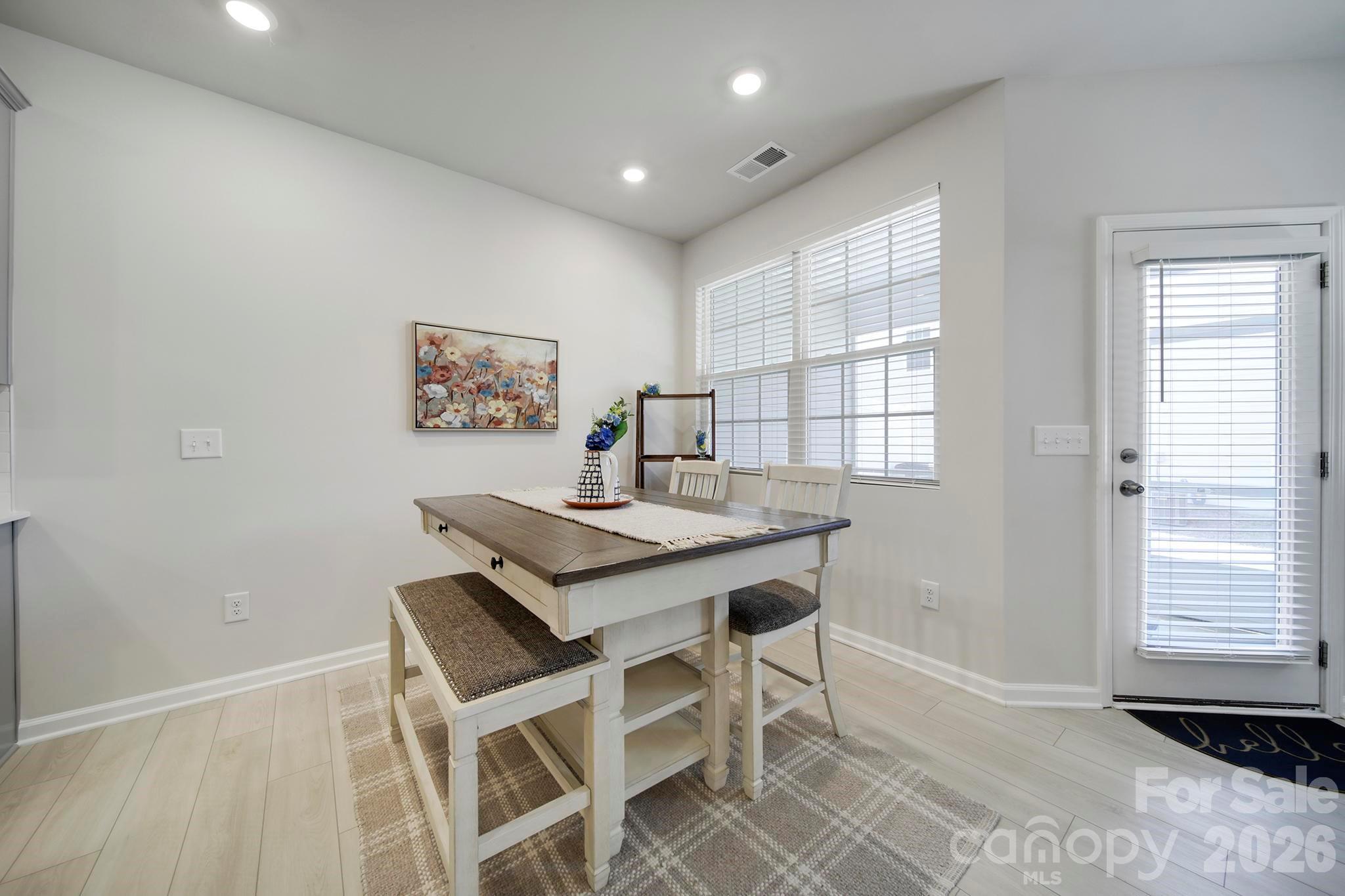 7032 Everly Commons Lane Fort Mill, SC 29708 - Photo 11 of 37 a view of a dining room with furniture and window
