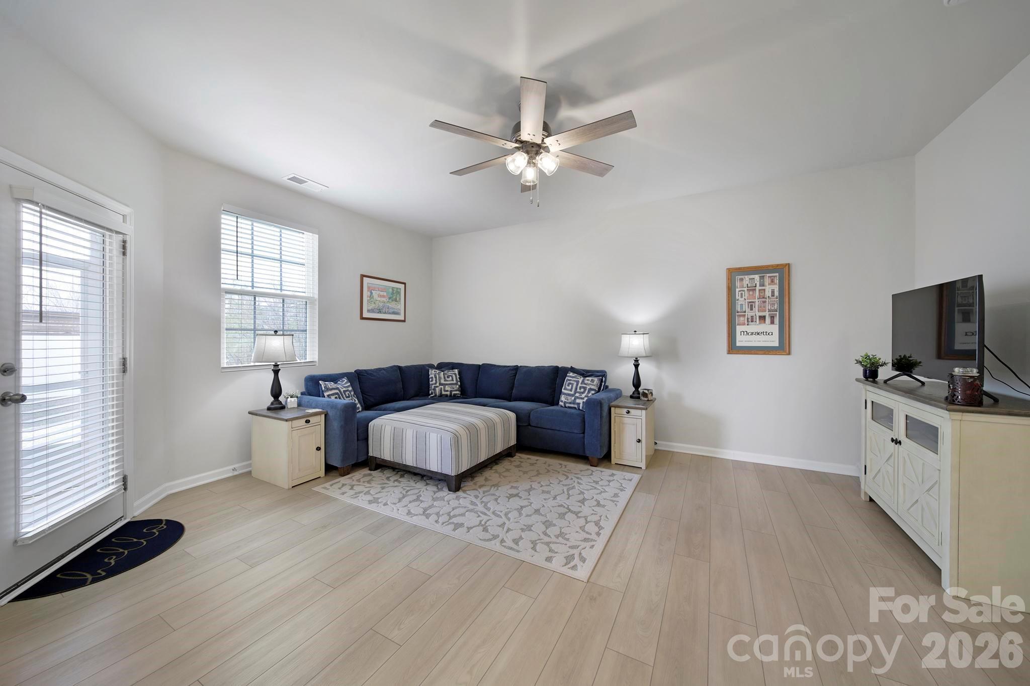 7032 Everly Commons Lane Fort Mill, SC 29708 - Photo 13 of 37 a living room with furniture and a flat screen tv