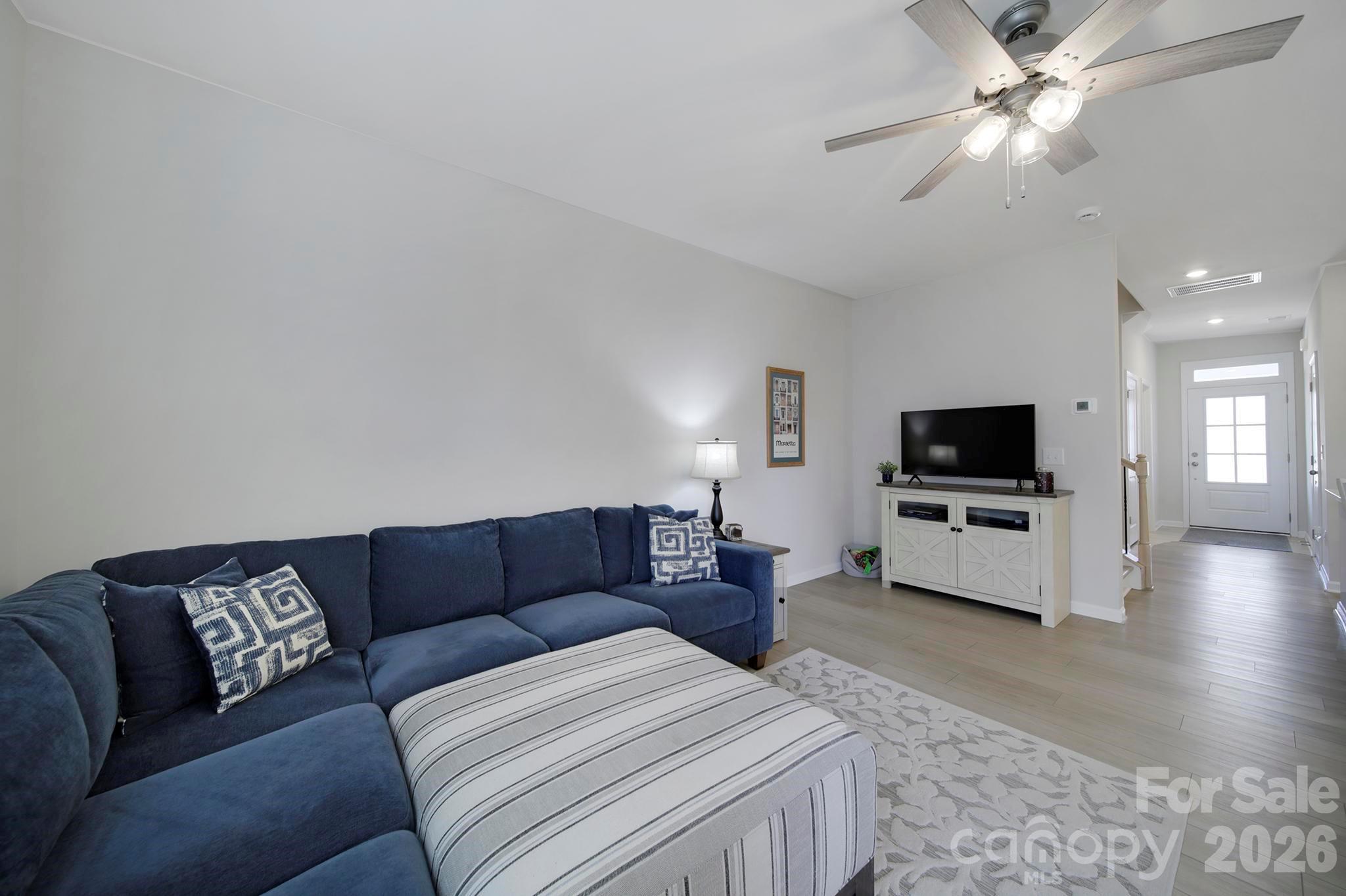 7032 Everly Commons Lane Fort Mill, SC 29708 - Photo 14 of 37 a living room with furniture and a flat screen tv