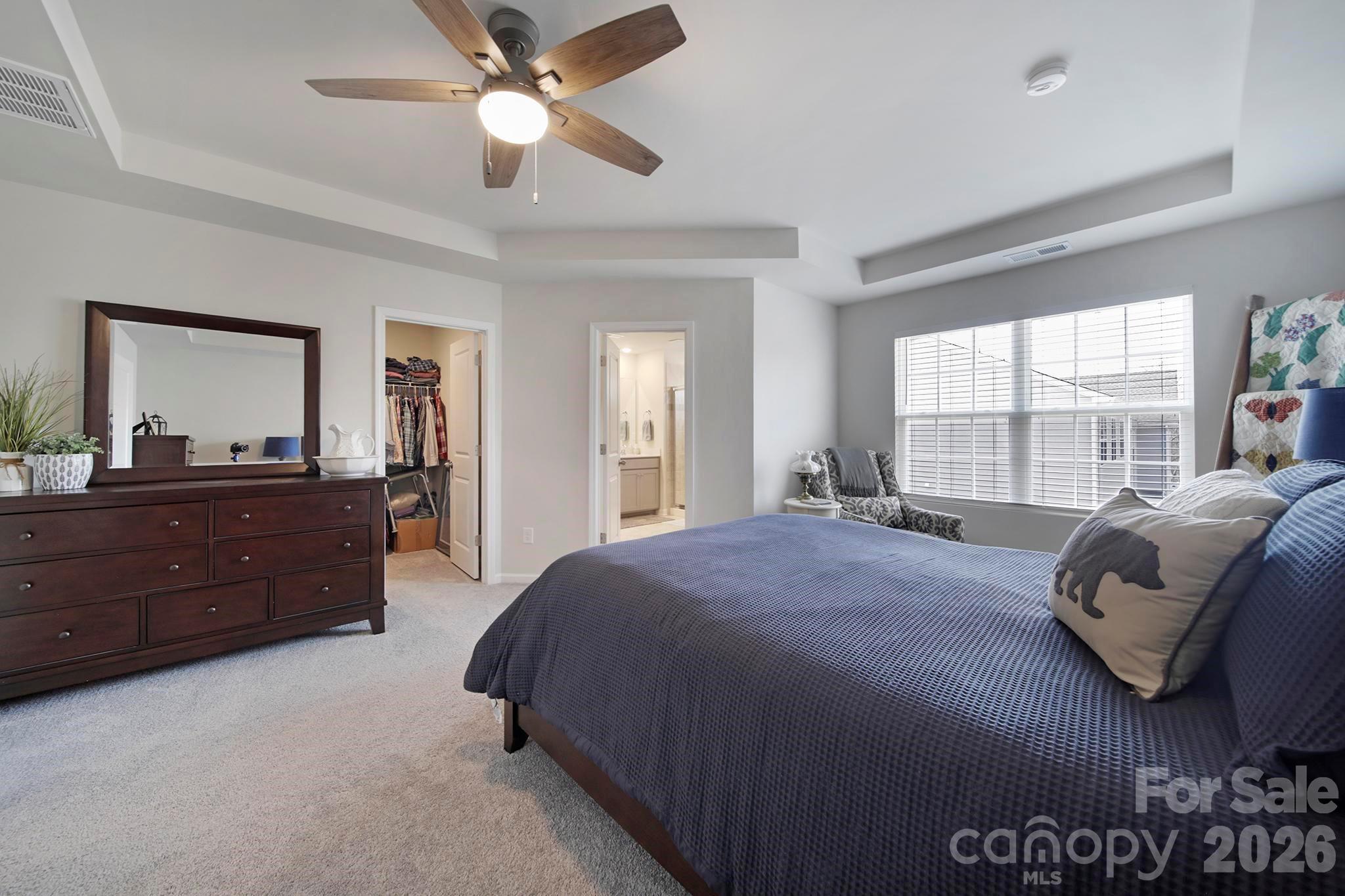 7032 Everly Commons Lane Fort Mill, SC 29708 - Photo 18 of 37 a bedroom with a bed and a large window