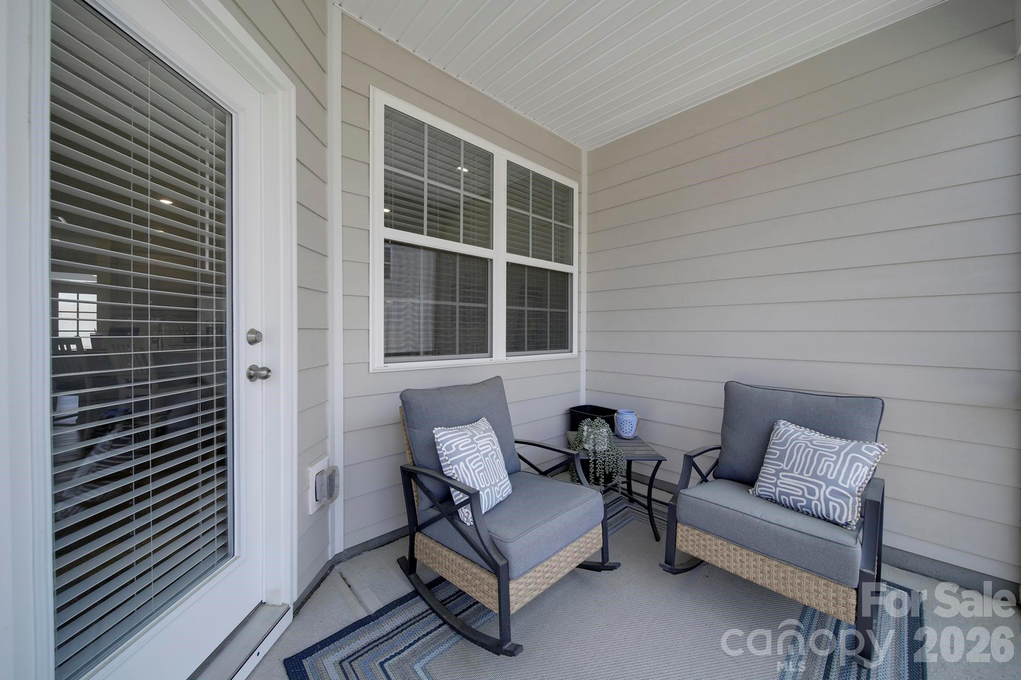 7032 Everly Commons Lane Fort Mill, SC 29708 - Photo 28 of 37 a outdoor living space with furniture and a window