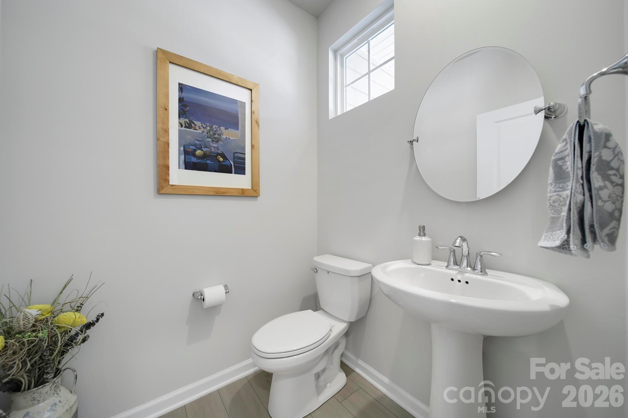 7032 Everly Commons Lane Fort Mill, SC 29708 - Photo 3 of 37 a bathroom with a toilet sink and mirror