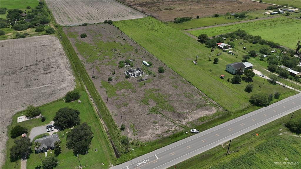 Aerial view of property's location with rural landscape and rows of crops