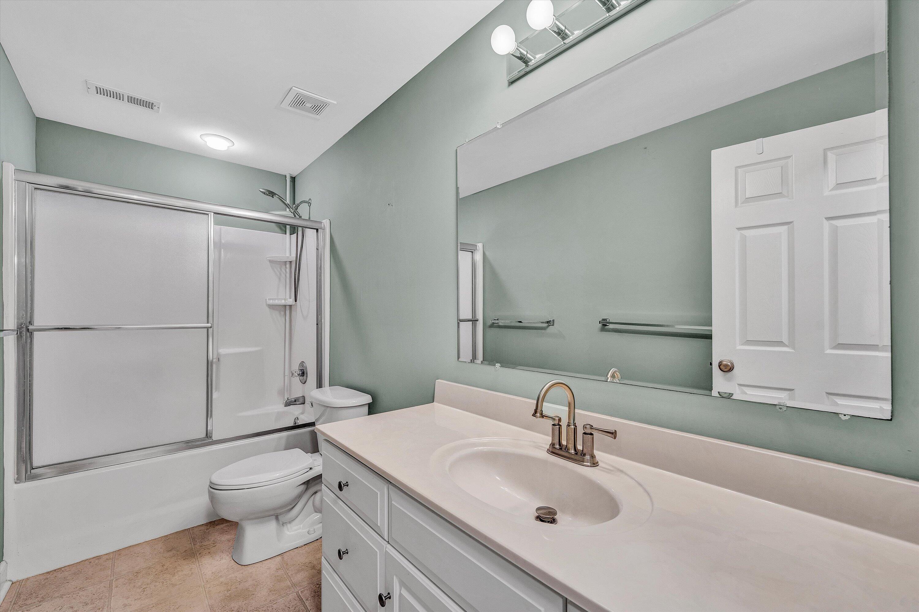 2326 Lake Retreat Road Huddleston, VA 24104 - Photo 11 of 42 a bathroom with a sink toilet and shower