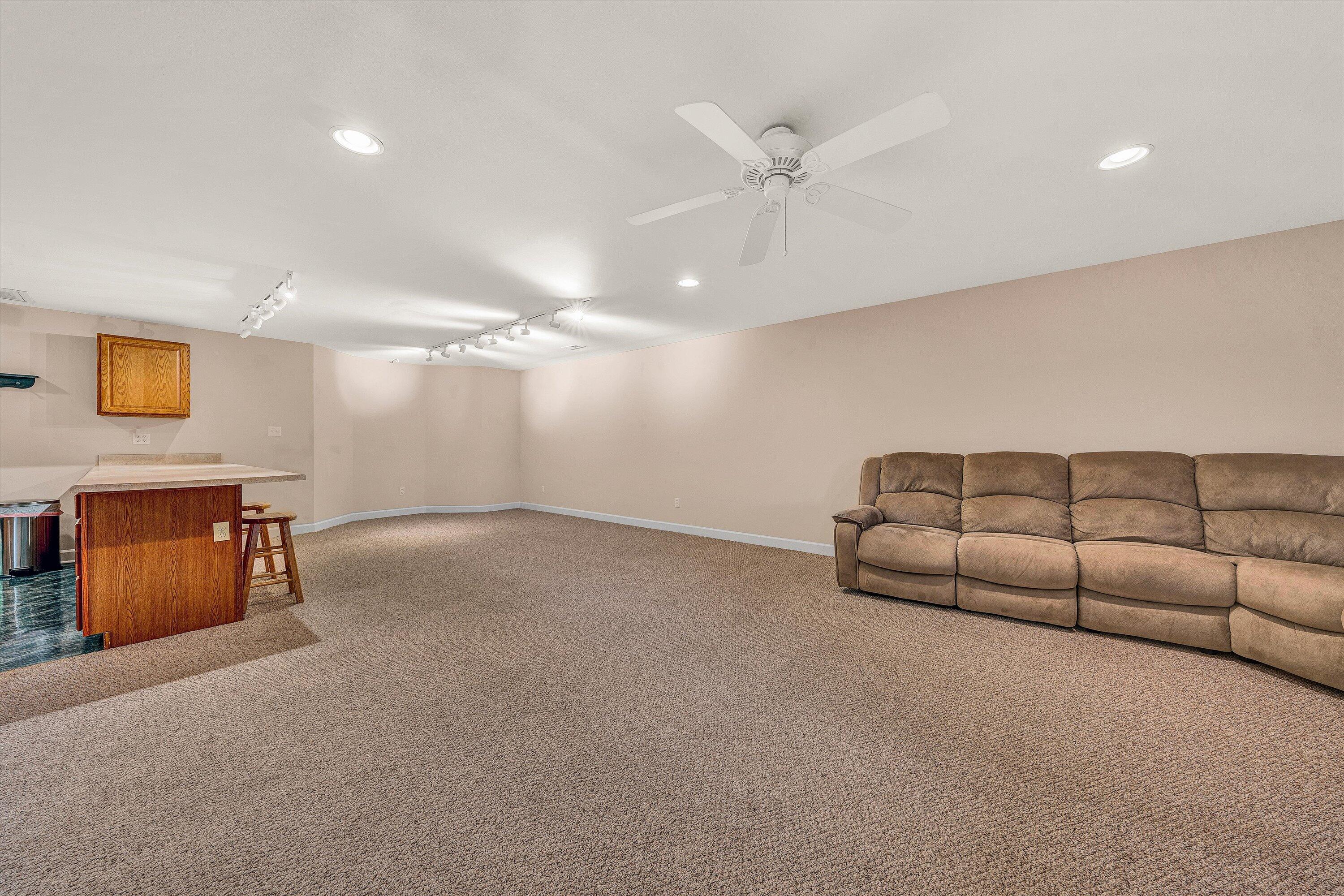 2326 Lake Retreat Road Huddleston, VA 24104 - Photo 22 of 42 a living room with furniture and a ceiling fan
