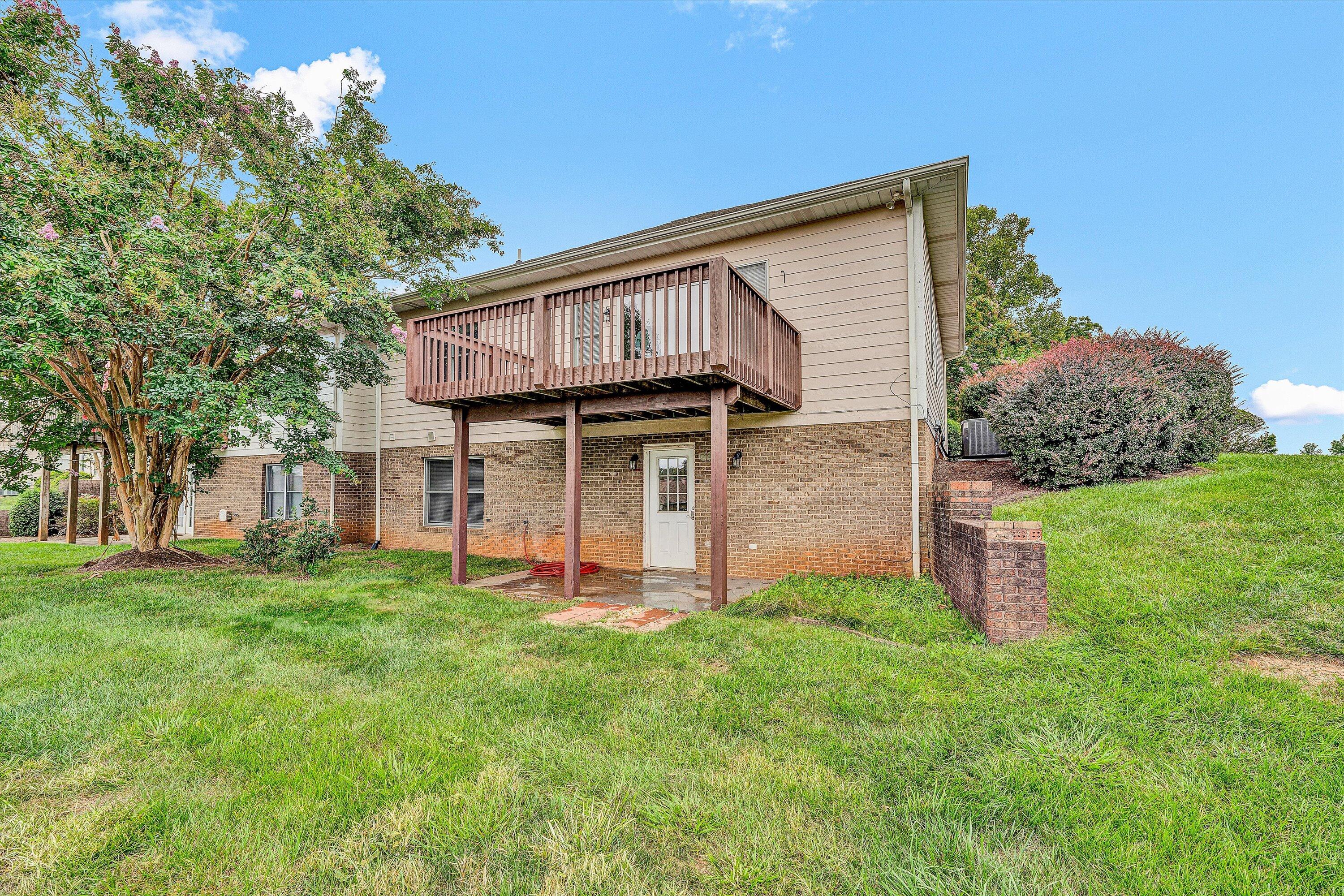 2326 Lake Retreat Road Huddleston, VA 24104 - Photo 23 of 42 a front view of a house with a yard and trees