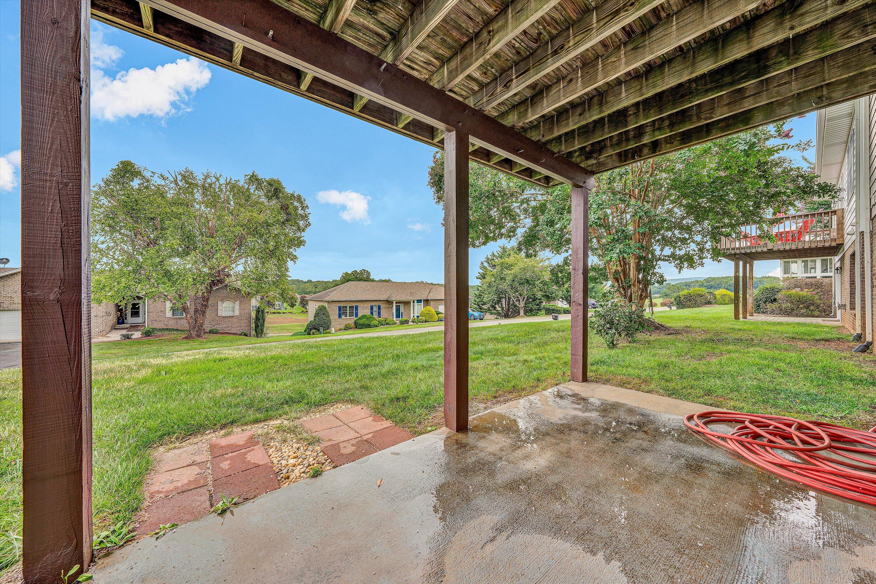 2326 Lake Retreat Road Huddleston, VA 24104 - Photo 25 of 42 a view of a house with backyard and porch