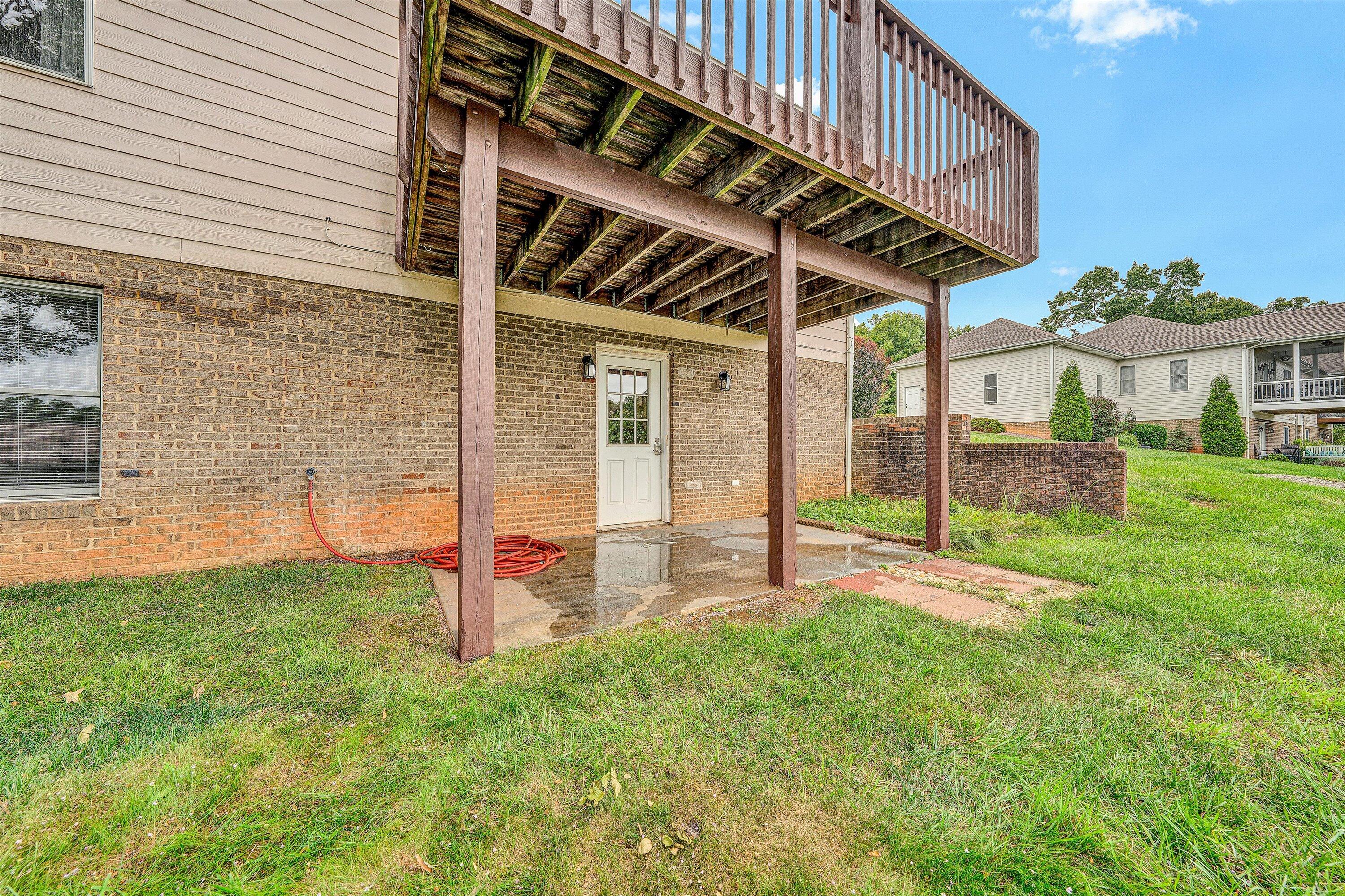 2326 Lake Retreat Road Huddleston, VA 24104 - Photo 27 of 42 a view of a backyard with table and chairs and potted plants