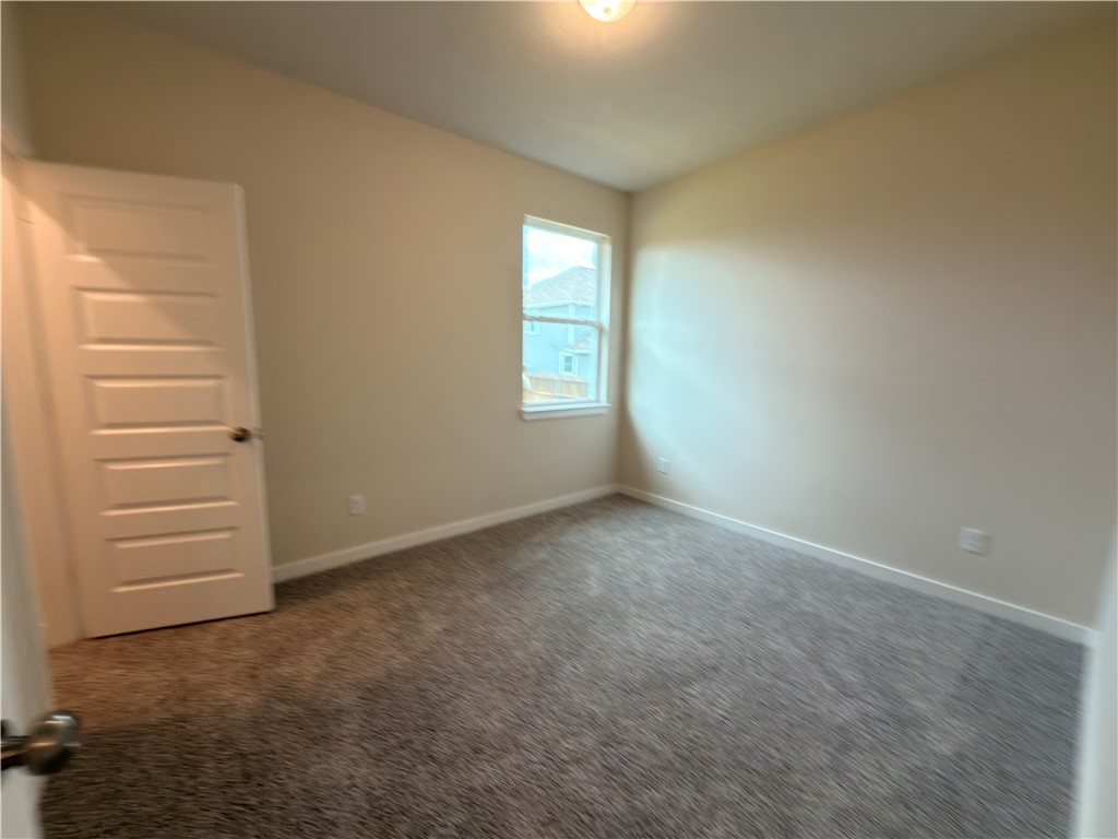 1394 Kingsgate Drive Bryan, TX 77807 - Photo 2 of 10 a view of an empty room with a window